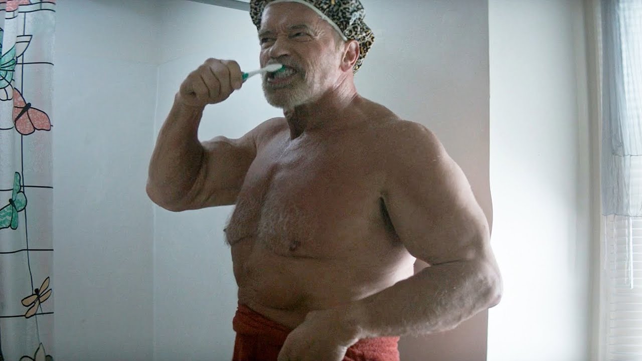 A person brushing his teeth

Description automatically generated