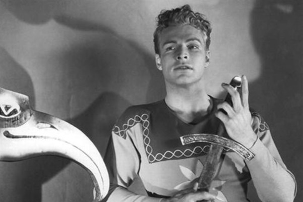 A person holding a microphone

Description automatically generated with medium confidence