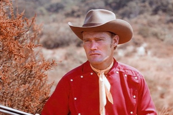 A person wearing a cowboy hat

Description automatically generated