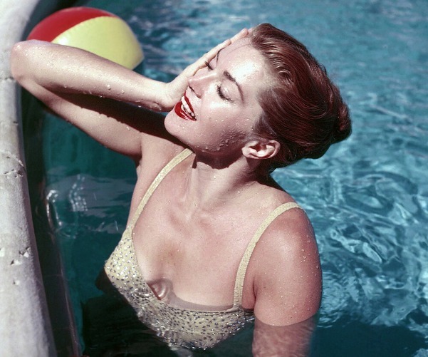 A picture containing person, child, swimming

Description automatically generated